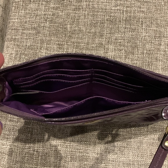 Coach large glossy patent leather wristlet in maroon/purple. Like new - Picture 3 of 4